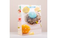 Kép 1/4 - Húsvéti dísztasak virág és festett tojás mintával, csillámporos nagy (32x26x10cm) 